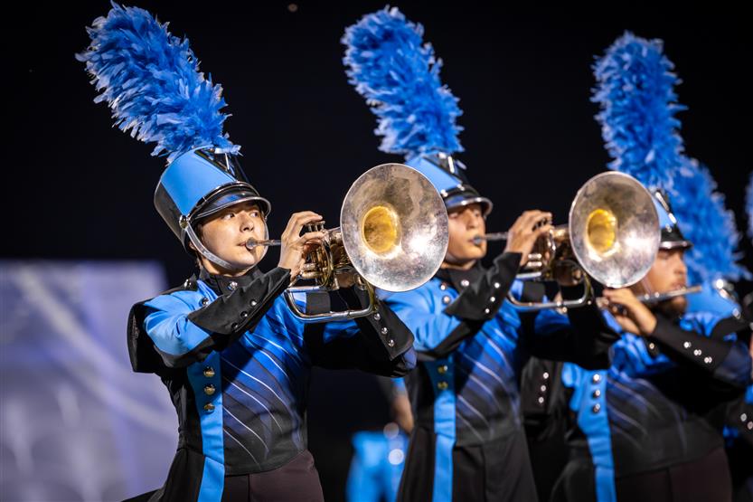 Students perform on football field